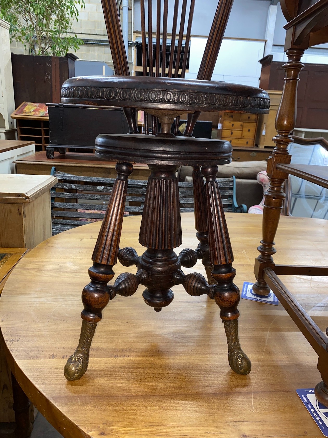 A 19th century French walnut harpist chair, with bronze feet
